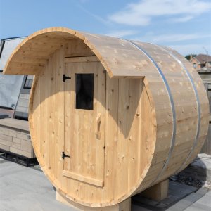 Barrel sauna kit with stainless steel bands, angled view